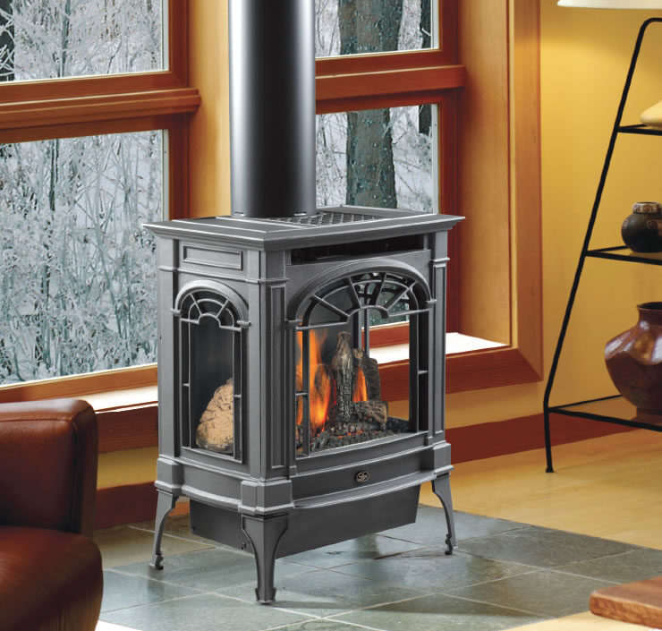 The Northfield™ cast iron gas stove is a true work of art. It’s classical Early American design and three-side bay window fireview more resembles a piece of fine furniture than a gas stove. The Award winning Ember-Fyre® Burner features realistic logs, glowing embers and the most wood-like fire of any gas stove. The standard GreenSmart™ Remote system with automatic heat/ flame adjustment with a huge high-to-low flame turndown ratio - up to 70%.    Comfort Control™ that allows you to turn off the rear burner for less heat to provide for year-round enjoyment of the fire. Choice of pilot ignition modes - Choose GreenSmart™Pilot • setting to save money or Continuous Pilot during winter months where a heated chimney is needed to maintain the draft to ensure proper operation. The 130 CFM fan increases efficiency by enhancing the transfer of convective heat in your home.